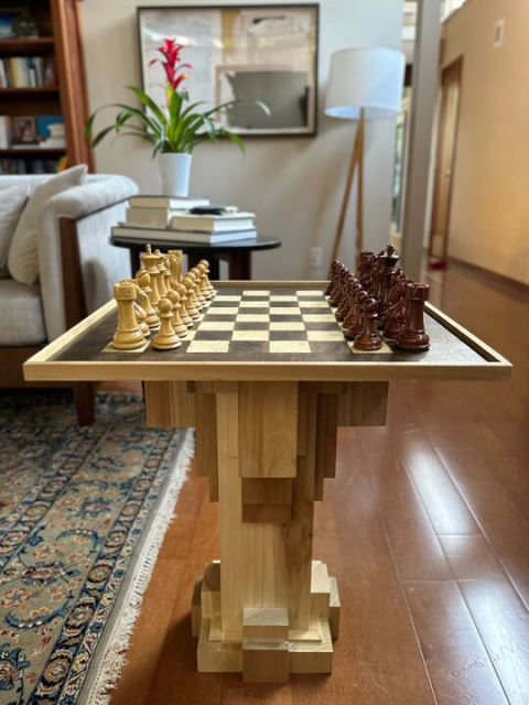 Wooden chess table with white and brown wooden chess pieces