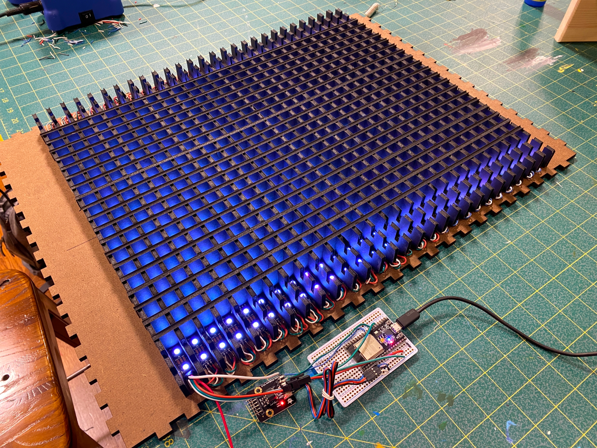 Assembled LED matrix connected to computer chip with lights on