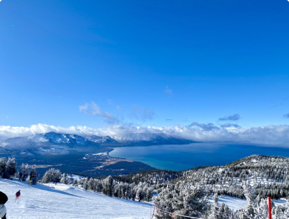 Ski slope on top of mountain facing Lake Tahoe